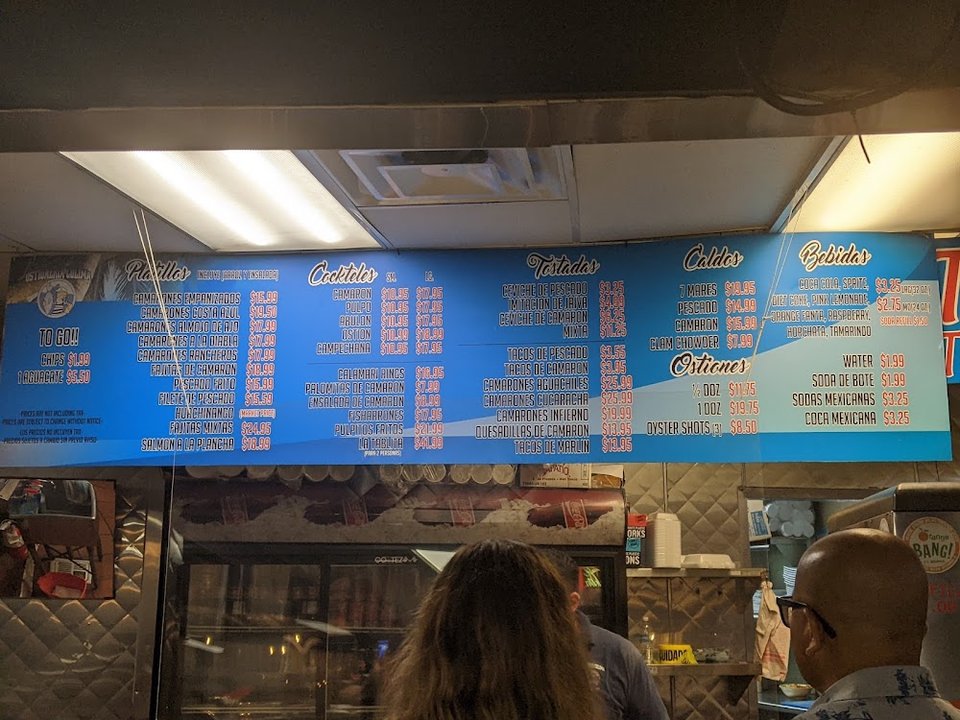Printed menu with soups, tacos, and oysters.